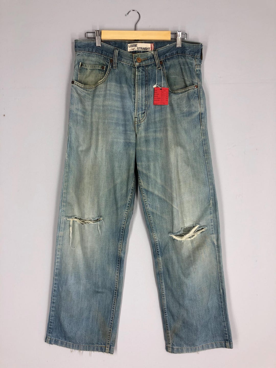 Vintage Levi's 569 Jeans: 90s Light Blue Stone Washed Ripped Denim