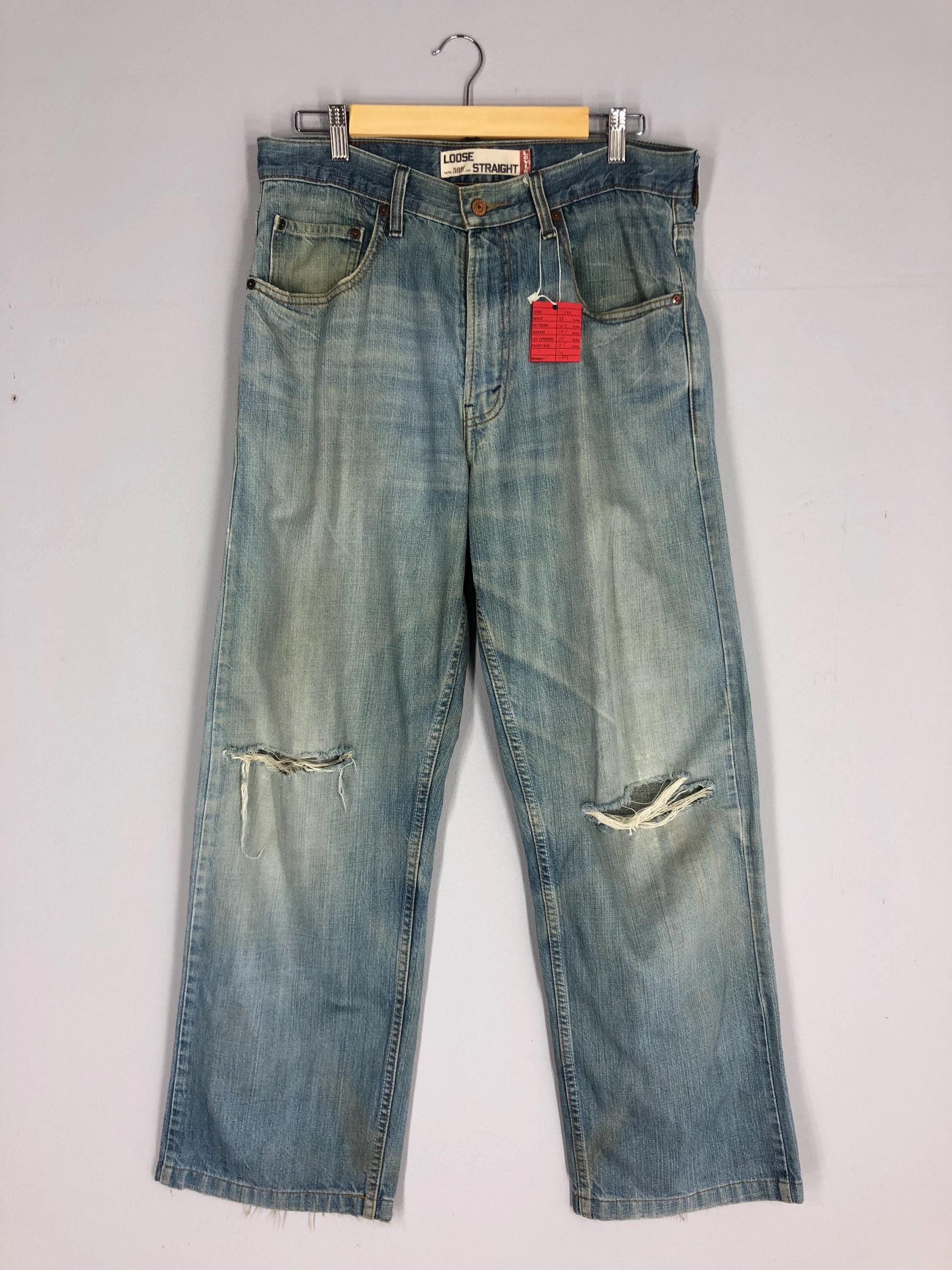 Vintage Levi's 569 Jeans: 90s Light Blue Stone Washed Ripped Denim