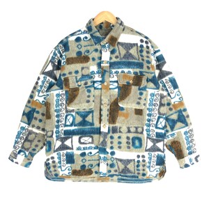 May include: A long-sleeved button-up shirt with a geometric pattern in shades of blue, brown, and white.