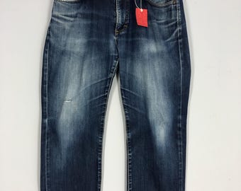 Jeansy Wrangler Vintage 34x38: Denim w kolorze Stone Washed Blue, wyblakłe i zniszczone