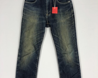 Vaqueros Wrangler vintage 30x39, denim lavado a la piedra, desgastados
