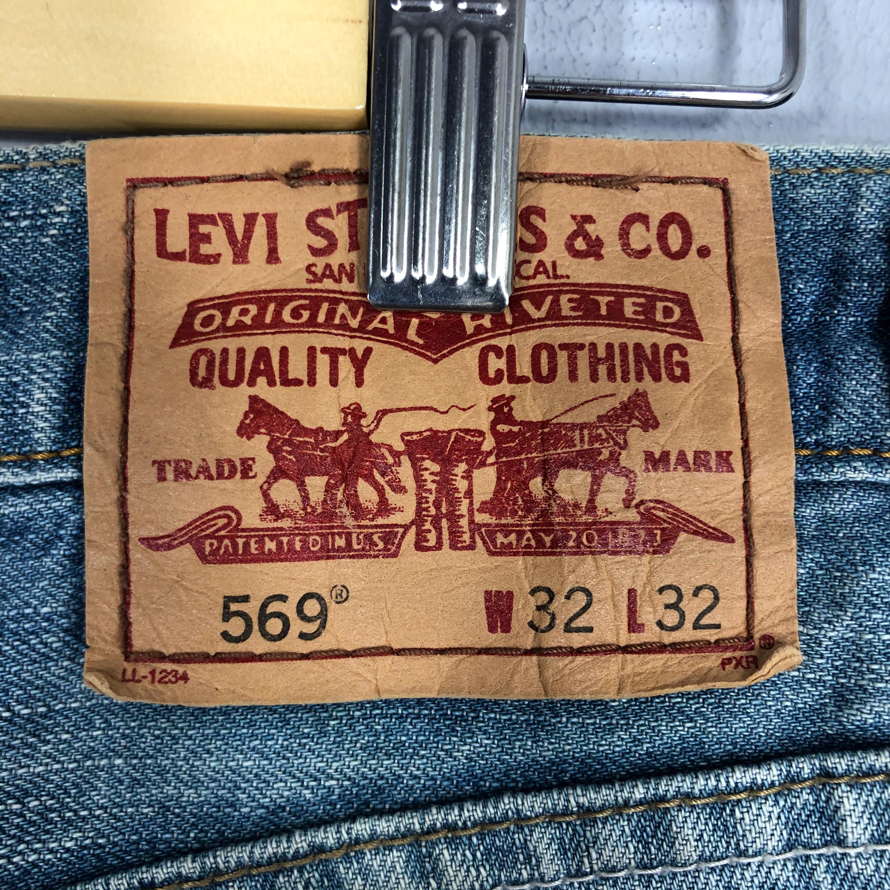 Vintage Levi's 569 Jeans: 90s Light Blue Stone Washed Ripped Denim