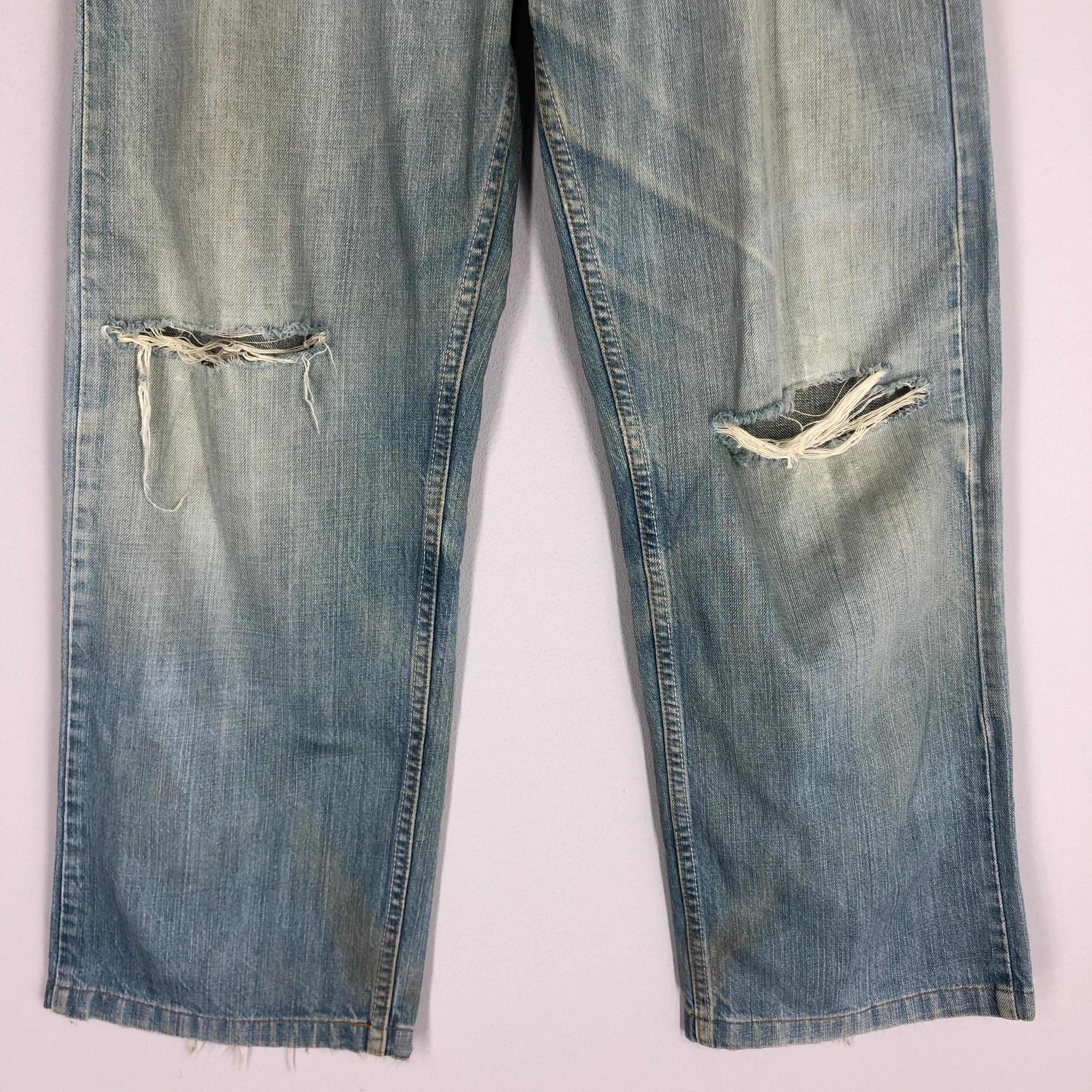 Vintage Levi's 569 Jeans: 90s Light Blue Stone Washed Ripped Denim