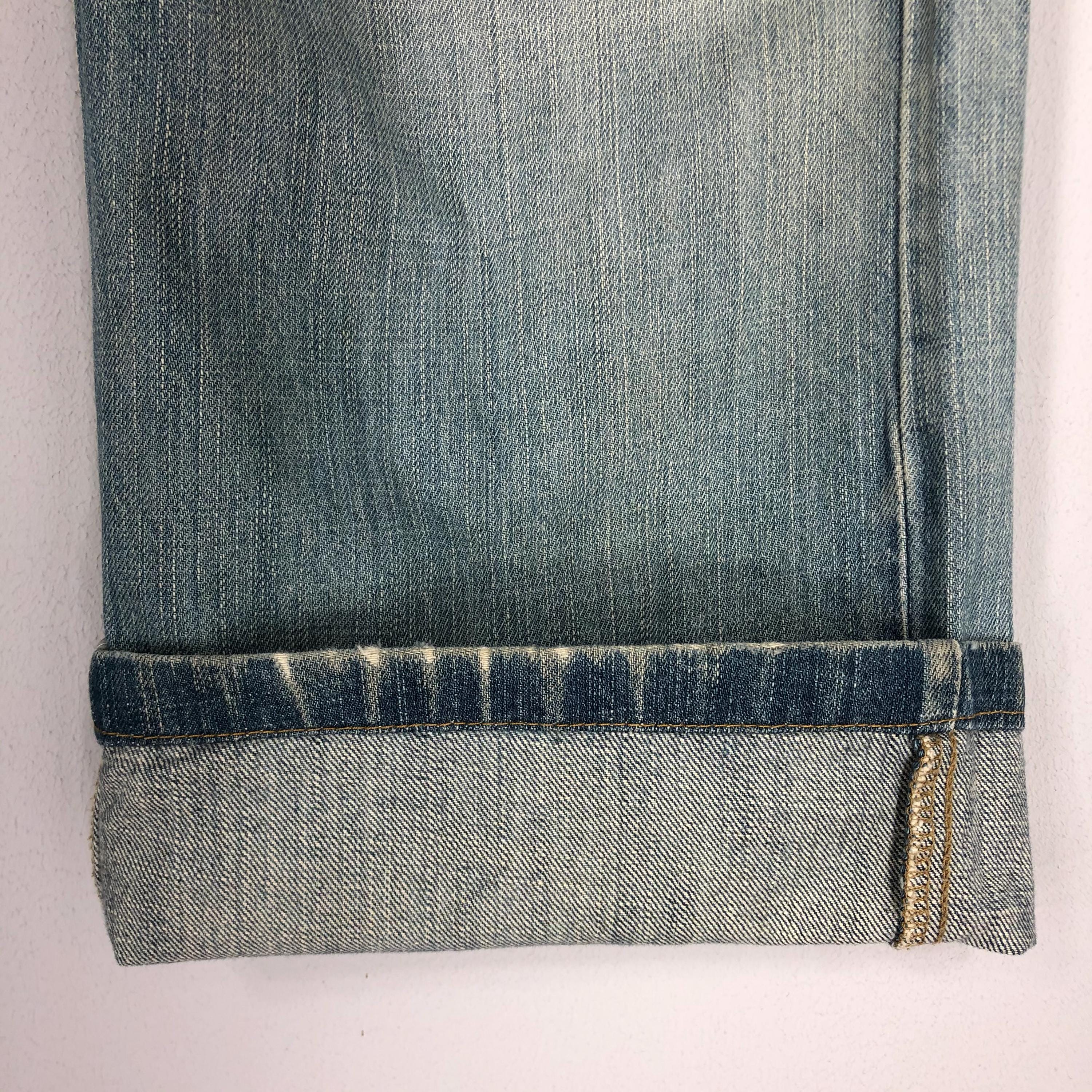 Vintage Levi's 569 Jeans: 90s Light Blue Stone Washed Ripped Denim