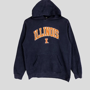 May include: A navy blue hooded sweatshirt with the word "ILLINOIS" in orange lettering and a white "I" in the centre.