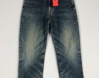 Vaqueros Wrangler vintage 33x41, denim lavado a la piedra, desgastados