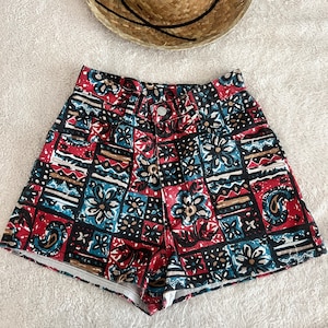 Vintage floral high waisted denim shirts tagged 3 24” waist