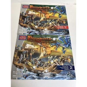 Könnte beinhalten: Zwei Mega Bloks Dragons Krystal Wars Man-O-War Baukästen. Jede Box zeigt eine Fantasy-Szene mit einem Schiff, Drachen und Figuren. Die Sets sind für Kinder ab 8 Jahren und enthalten 250 Teile.