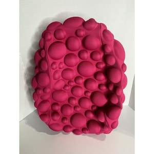 May include: A set of three ceramic mugs with a speckled, matte finish. The mugs are in shades of cream, light gray, and dark gray. Each mug has a simple, minimalist design, perfect for coffee or tea.