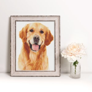 May include: A framed cross-stitch portrait of a golden retriever dog with a happy expression. The dog is looking directly at the viewer with its tongue sticking out.