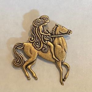 Art nouveau Lady Godiva and horse brooch flowing hair antique gold finish. brooch pin vintage finding