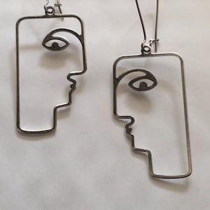 Outline human face to face head quirky modernist design handmade silver tone charm earrings for pierced ears