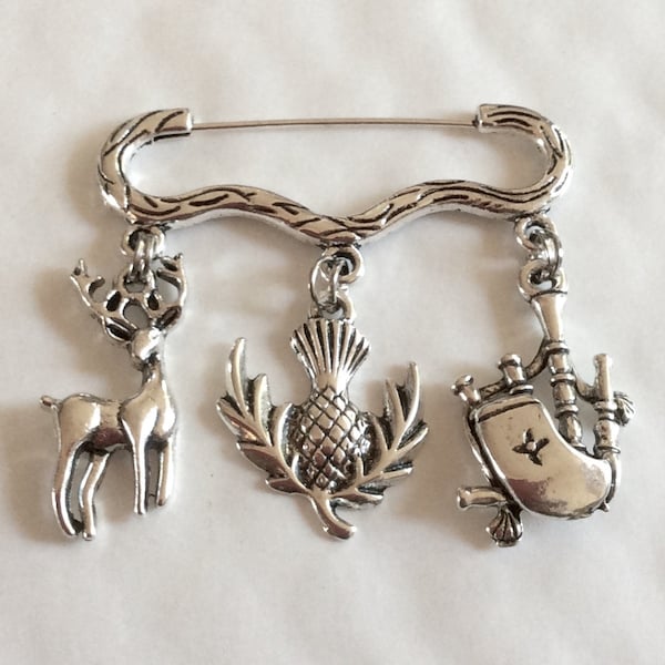 Scottish icon thistle, bagpipe and stag charm silver tone brooch / pin