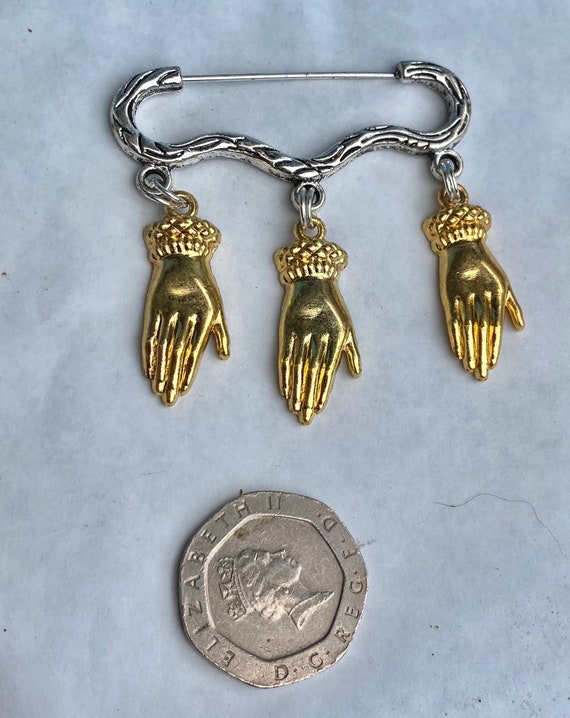 Hand brooch deals