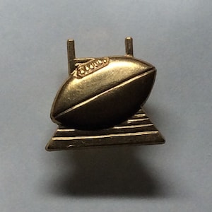 Cute Rugby ball and posts little lapel pin raw brass handmade from vintage finding tie tack fastening