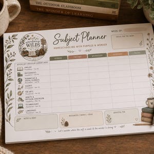 May include: A subject planner with the text "Subject Planner Homeschooling with Purpose & Wonder". The planner has sections for each day of the week, with areas for notes and ideas. A pen and a mug are on the wooden surface.