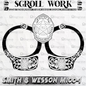 May include: Black and white graphic of handcuffs and a police badge. The badge is from the Dallas Police Department, with a star in the center. The text "SCROLL WORK" is at the top, and "SMITH & WESSON M100-1" is at the bottom.