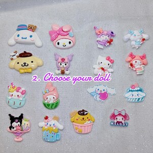May include: A collection of colorful, cartoon character-themed resin charms. The charms feature various characters in pastel colors, including a white dog with a blue hat, a pink cat with a bow, and a yellow dog in a cupcake. The text "2. Choose your doll" is also present.