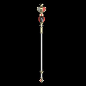 May include: A gold and red scepter with a heart-shaped top. The heart is divided into two halves, one red and one black. The scepter has a long, thin shaft and a small, pointed tip.