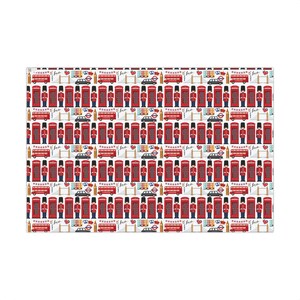 May include: Three rolls of London-themed wrapping paper feature red telephone booths, guards, buses, and crowns on a white background.  The text 'London' is visible on one roll.  The paper is ideal for gift-wrapping and showcases a classic British design aesthetic.
