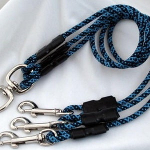 May include: A blue and black braided rope dog leash with three metal clips.