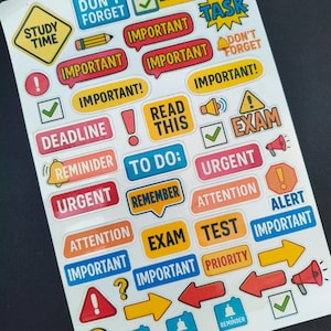May include: A sheet of colorful stickers with various text labels and icons. The stickers include phrases like "Important," "Exam," "Deadline," and "Urgent." There are also checkmarks, exclamation points, and arrows. The stickers are designed for organization and reminders.