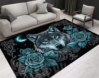 May include: Black area rug featuring a detailed wolf portrait with blue eyes, surrounded by teal roses and a crescent moon. The rug has a decorative border with a starry night sky design.