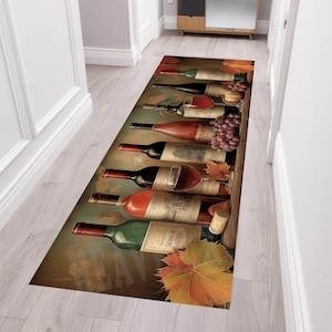 May include: A rectangular runner rug featuring a printed design of multiple wine bottles arranged horizontally. The bottles are in shades of green, red, and brown, accompanied by clusters of purple grapes, a cork, and scattered orange autumn leaves.