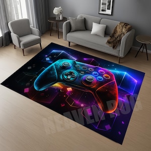May include: A rectangular rug with a neon-lit video game controller design. The controller is mainly blue, with purple, orange, and green highlights. The rug's background is black with geometric shapes and measures approximately 180cm x 120cm.