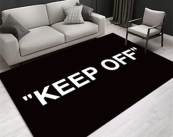 Black "Keep Off" Rug: Modern Graphic Floor Covering