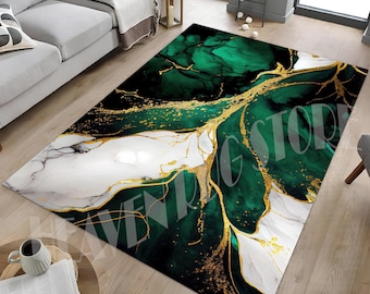 May include: A rectangular area rug with a marble design. The rug features a combination of emerald green, white, and gold colors. The design has a marbled effect with gold veins running through the green and white sections. The rug is placed on a wooden floor.