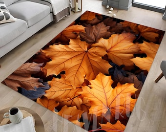 May include: A close-up of a brown and orange area rug with a pattern of autumn leaves. The leaves are arranged in a random pattern and are in various shades of brown and orange.