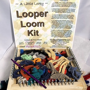 May include: A wooden loom kit for making potholders. The kit includes a wooden loom, crochet hooks, and a variety of colorful yarn loops. The kit is labeled "Looper Loom Kit" and includes instructions for making potholders. The kit is available in four sizes: Jumbo, Traditional, Hybrid, and Baby. The colors are assorted.
