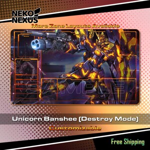 May include: A rectangular playmat featuring a detailed illustration of the Unicorn Banshee (Destroy Mode) character. The mat has a dark background with orange and yellow accents, and includes the text "More Zone Layouts Available" and "Customizable".