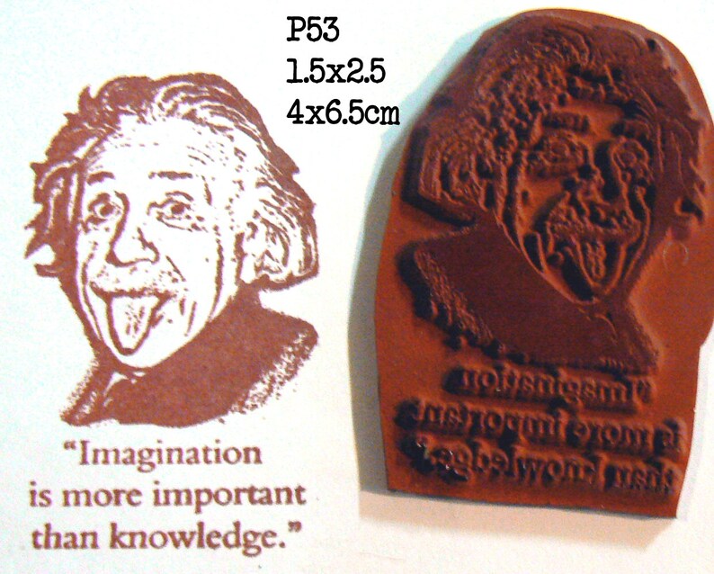 May include: A rubber stamp featuring a brown image of Albert Einstein sticking out his tongue. The stamp is labeled P53 and measures 1.5 x 2.5 inches. The quote "Imagination is more important than knowledge" is printed below the image.