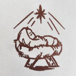 May include: A brown line drawing of a baby in a manger with a star above it.