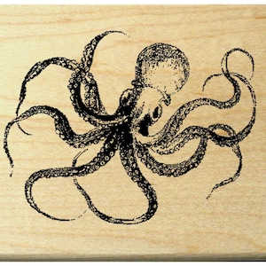 May include: A black and white illustration of an octopus with detailed tentacles. The octopus is centered on a light-colored wooden surface. The image is a detailed, vintage-style drawing.