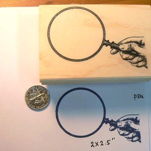 P34 Looking glass rubber stamp
