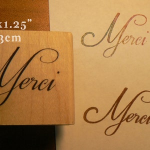 Timbro in gomma con scritta Merci P62