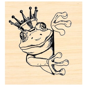May include: A black and white line drawing of a frog wearing a crown. The frog is peeking around a corner. The frog is smiling.