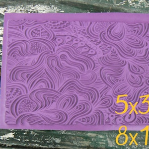 May include: Purple silicone mold with a swirling pattern. The mold measures 5x3 inches and 8x13 centimeters.