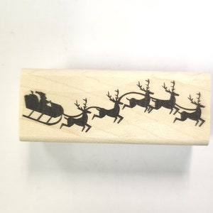 Papai Noel com carimbo de trenó P22