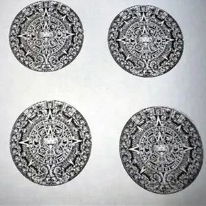 May include: Four black and white circular designs of the Aztec calendar, also known as the Sun Stone, on a white background.