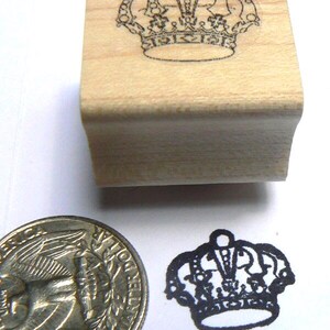 P24 Miniature crown rubber stamp WM and measures 0.7x0.5