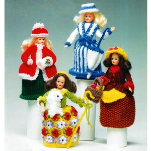 May include: Four knitted dolls dressed in different outfits. The dolls are wearing a red coat with a white trim, a blue and white striped dress, a brown dress with a yellow apron, and a green dress with a white lamb.