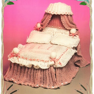 May include: A handmade crochet bed in shades of pink and white, featuring a canopy, pillows, and a ruffled bed skirt. The bed is adorned with decorative bows and ribbons, creating a delicate and charming aesthetic. The overall design suggests a vintage or handcrafted style.