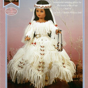 May include: A white crocheted wedding dress with beaded accents and fringe for a 14 1/2 inch doll. The dress is designed for a Native American doll and features a beaded headband.