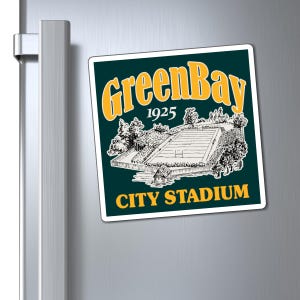 May include: A square magnet with a dark green background and a white border. The magnet features a vintage illustration of a stadium with the text "Green Bay 1925 CITY STADIUM" in yellow.