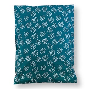 May include: Teal blue poly mailer with a white polka dot pattern.