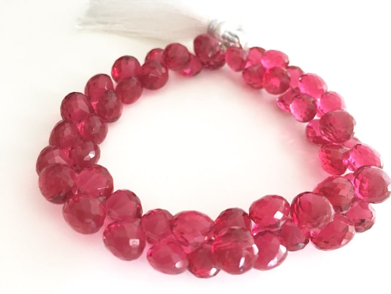 Pomegranate colored hydro quartz faceted onion
